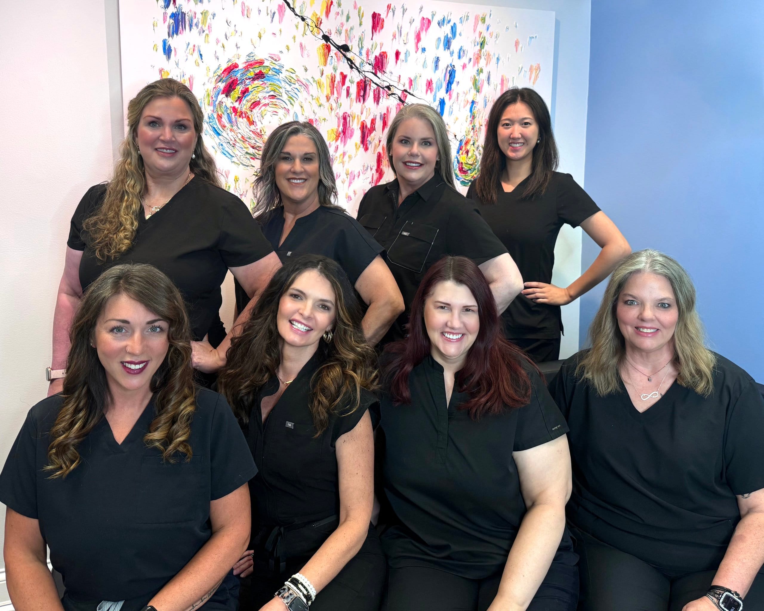 Dedicated Medical Staff Posed Together in a Modern Clinic Setting – Nashville Health Pro Professional Healthcare Team Smiling Together to Highlight Expertise and Patient Care – Nashville Health Pro